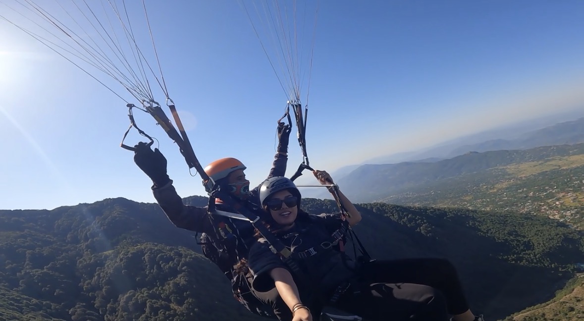 Paragliding over a valley